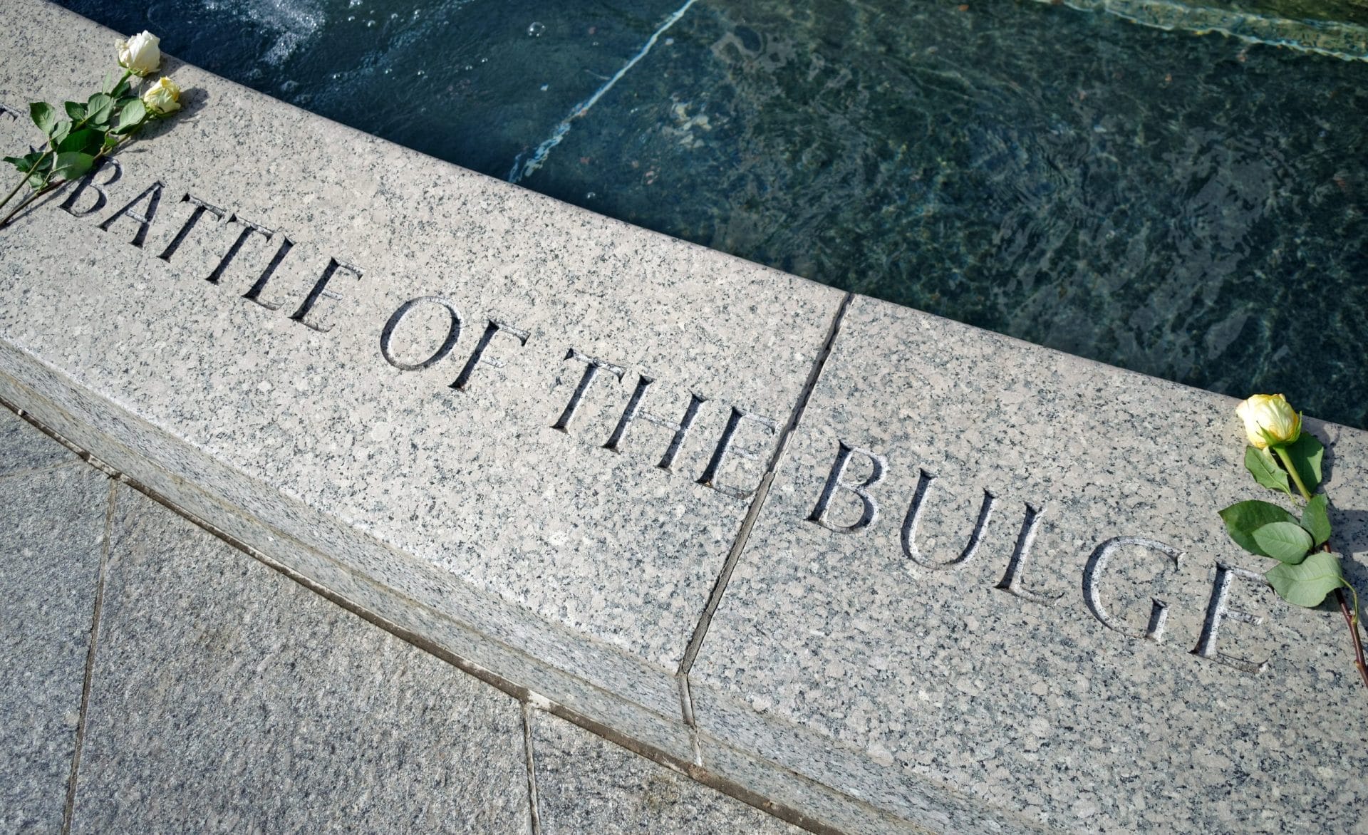 Inscription Battle of the Bulge and two roses on the World War II Memorial, Washington, D.C.